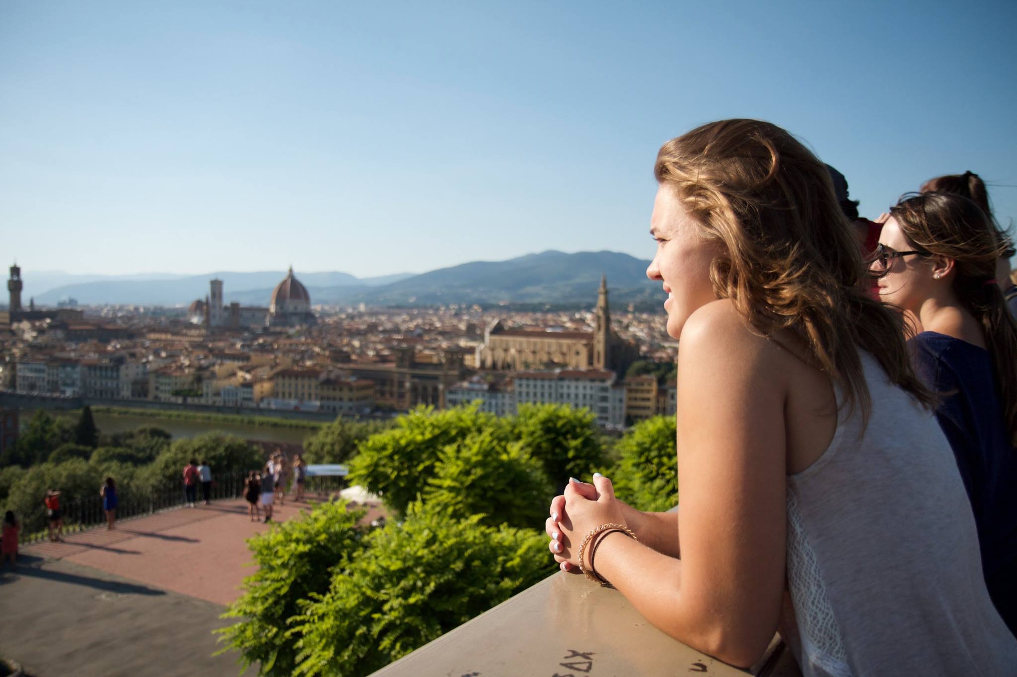 Female student looking over the city at her study abroad.