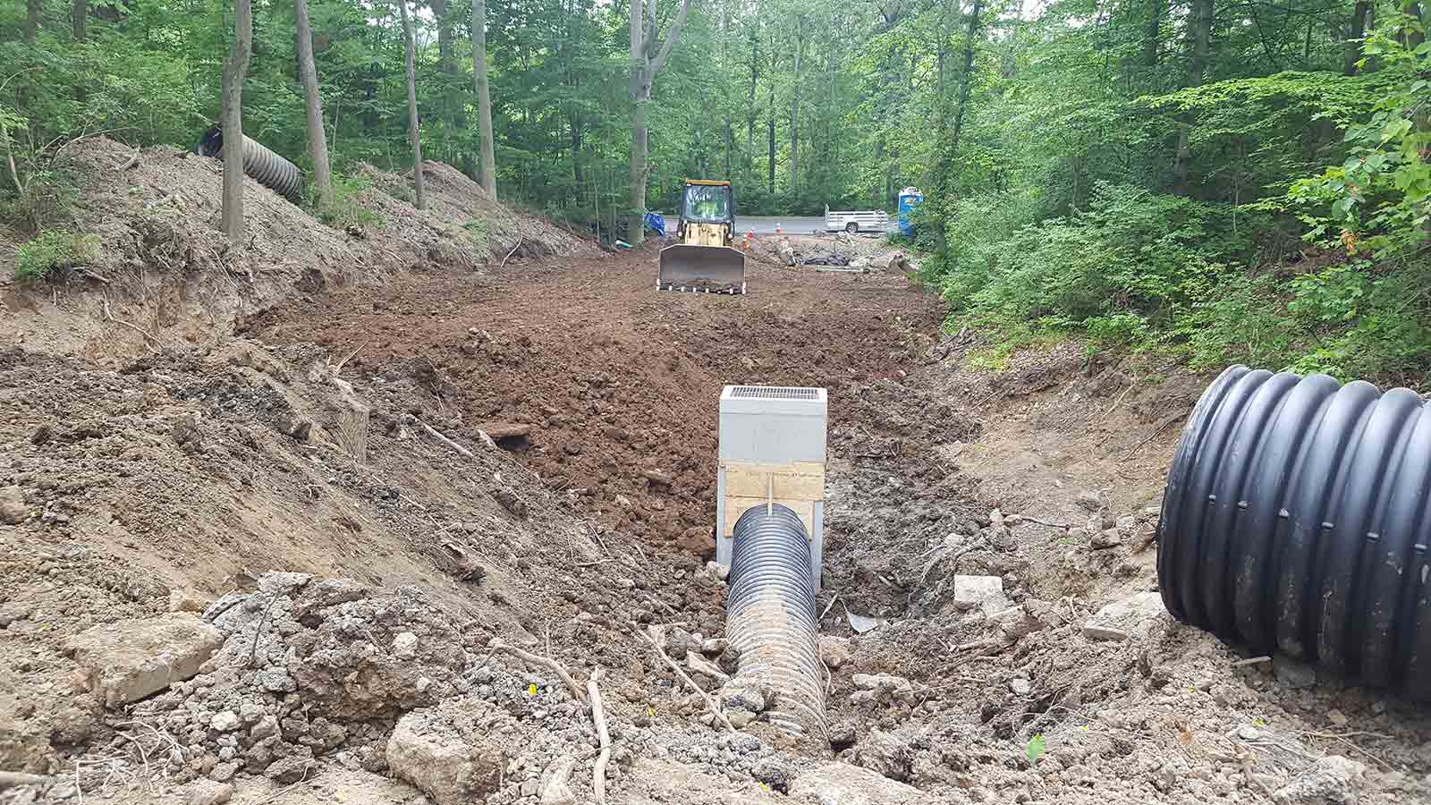 Pipes being installed during a ravine restoration.