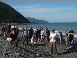 Group on a pebble beach in New Zealand