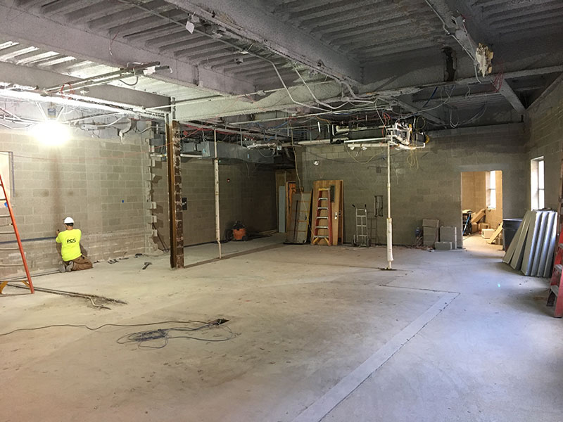 Another angle of a worker of working on the Larsen finance lab renovation project.