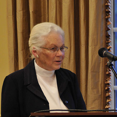 Kay Boyer talking on podium.