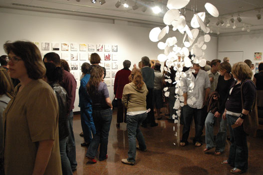 Students at an art exhibition at the High Center.