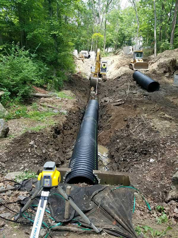 Underground pipe being installed during Ravine Restoration.