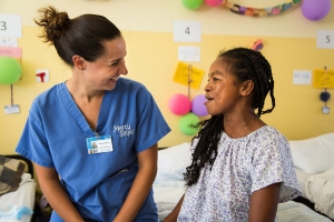 Deborah Mascia visits with a patient