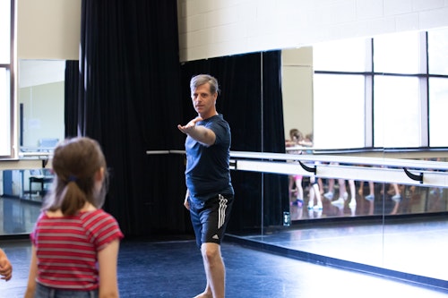 A student and instructor at theater camp.