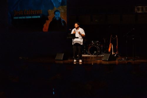 Student ministries teaching coordinator leading chapel. 