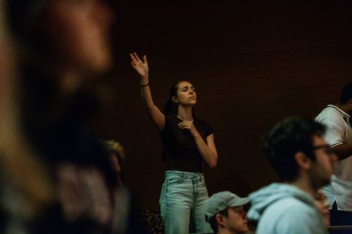A female student worshipping during Chapel. 
