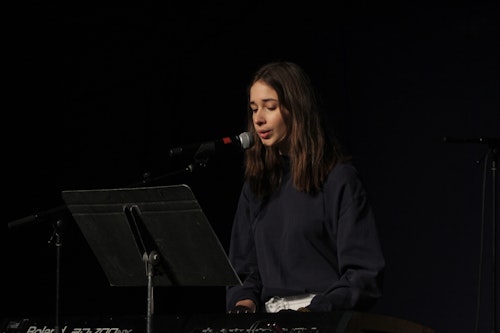 A student leading worship