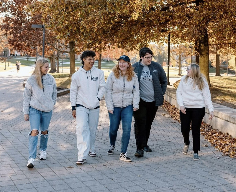 A group of students wearing official Messiah merchandise.