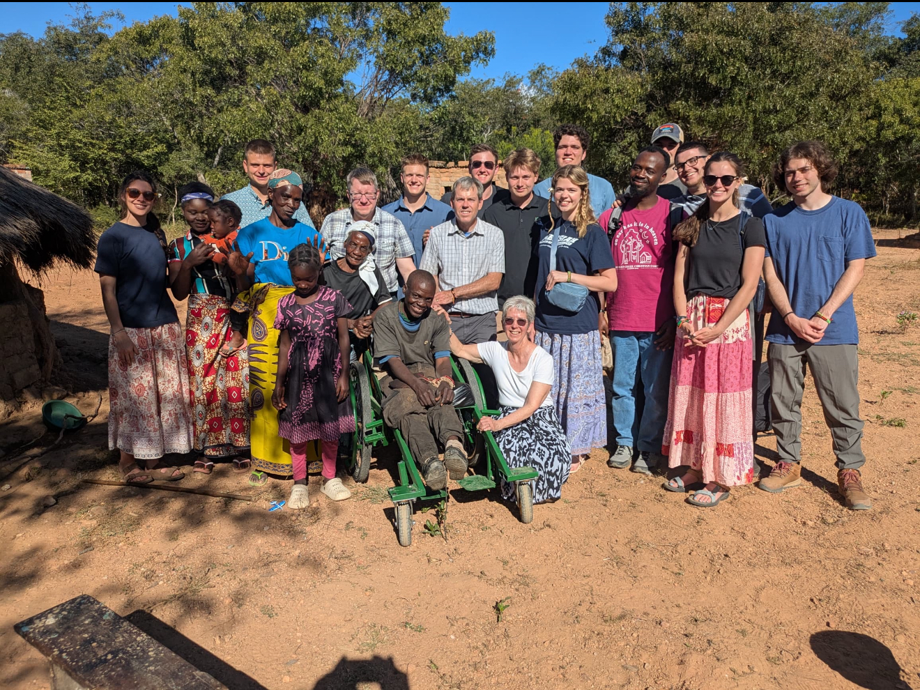 Sikalongo Zambia Wheelchair Team with the local community after delivering the locally made wheelchair in 2025.