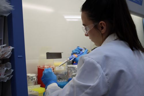 A student working on the socket lamination project