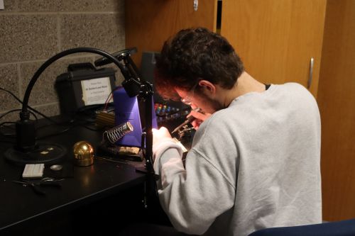 Students working on the fluency assistive device project