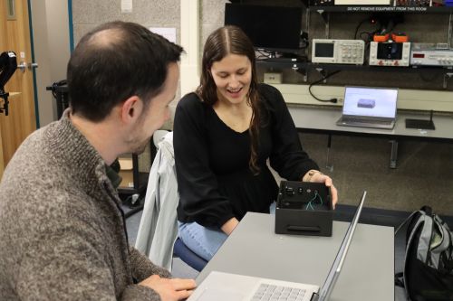 Students working on the piano pedal project