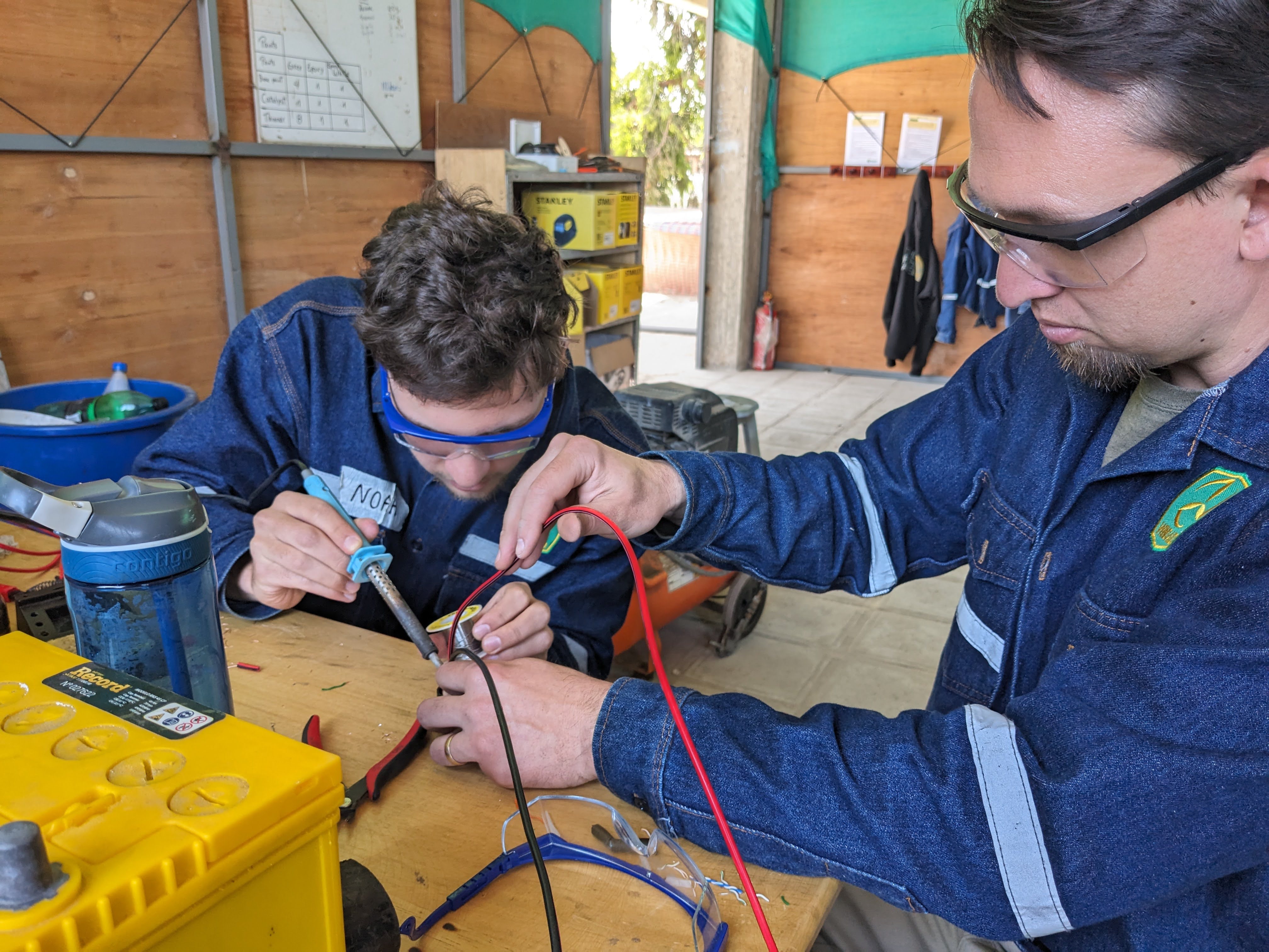 Faculty and student working at WindAid in Peru.