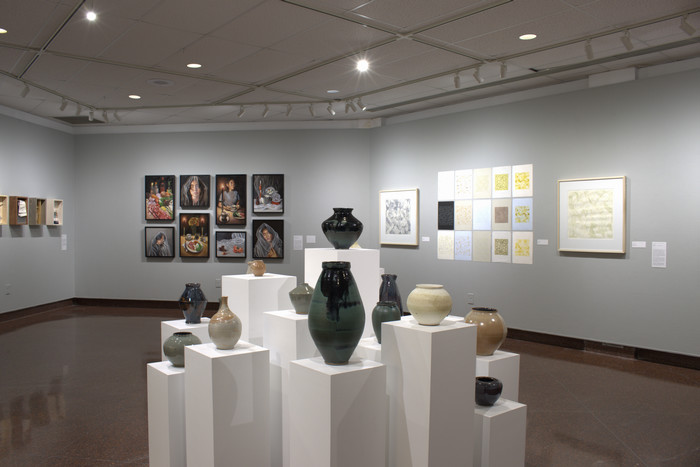 Room with pottery and art
