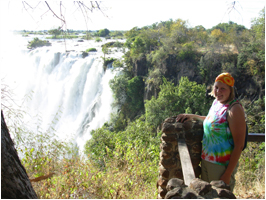 Female student standing next to Victoria Falls