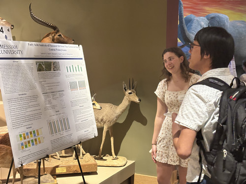 Izzy Stults at SEH Symposium Poster Session