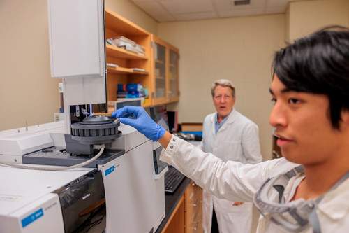 Anne Reeve and student conducting research in lab