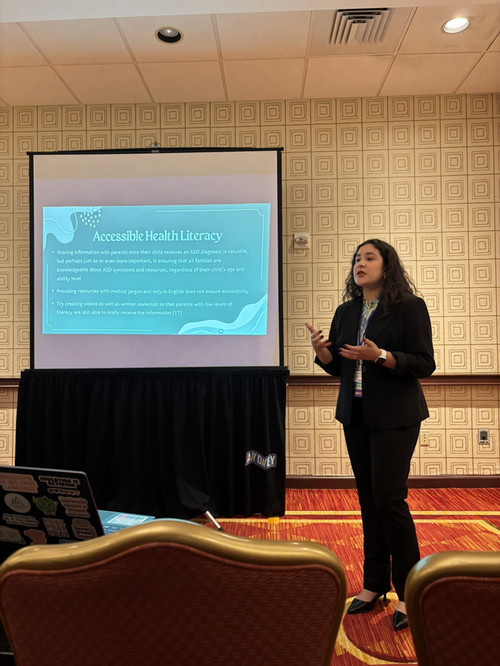 Mila Acosta Morales speaking at an event