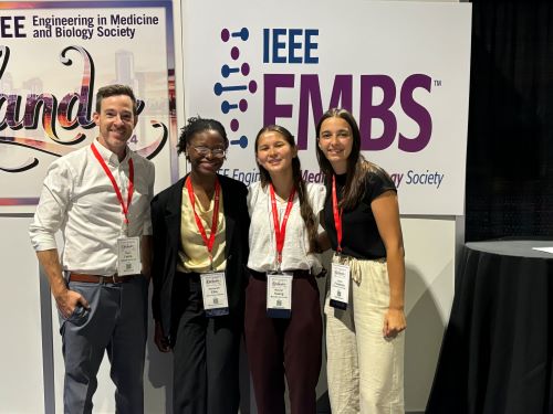 Rachel Huang with colleagues at a conference