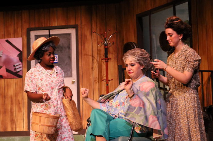 Performers on stage during the production of Steel Magnolias.