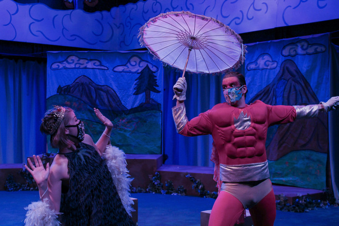 A performer on stage during the production of The Birds.