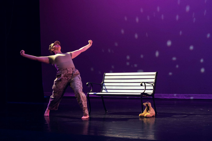 A performer on stage during the production of Blue Christmas '20.