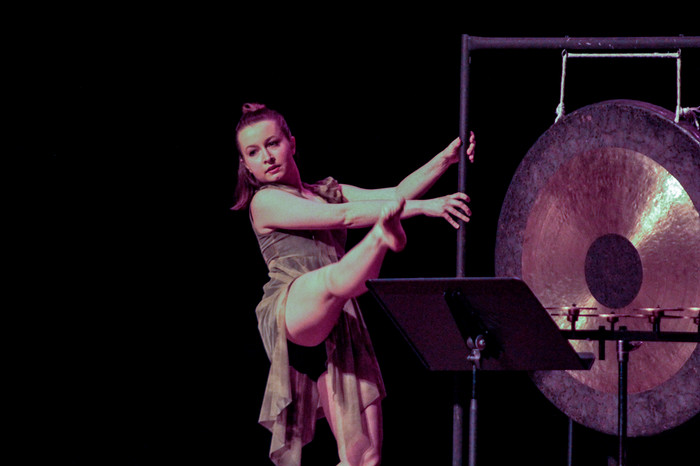 A performer on stage during the production of Drums and Dance.