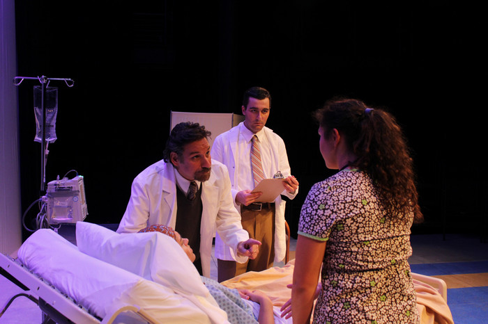 Performers on stage during the production of W;t.