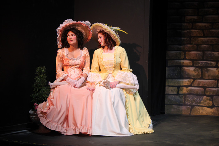 Performers on stage during the production of She Stoops to Conquer.