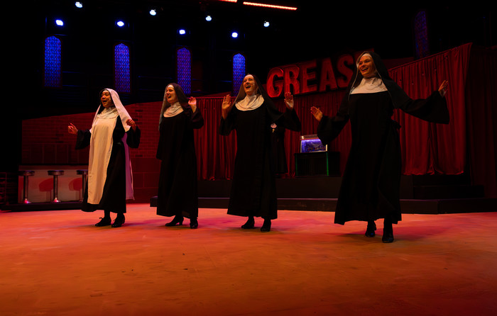 Performers on stage during the production of Clue.