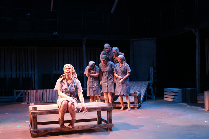 Performers on stage during the production of Who Will Carry the Word?.
