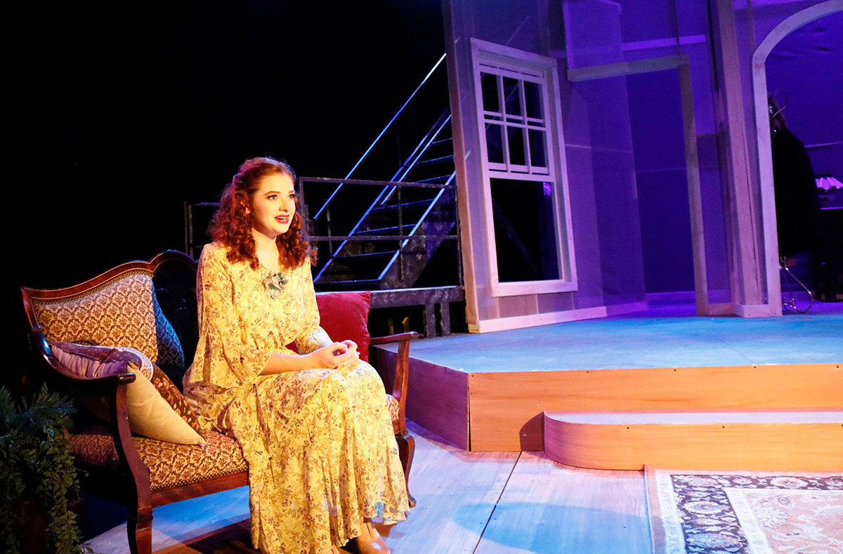 A student performing in The Glass Menagerie. 