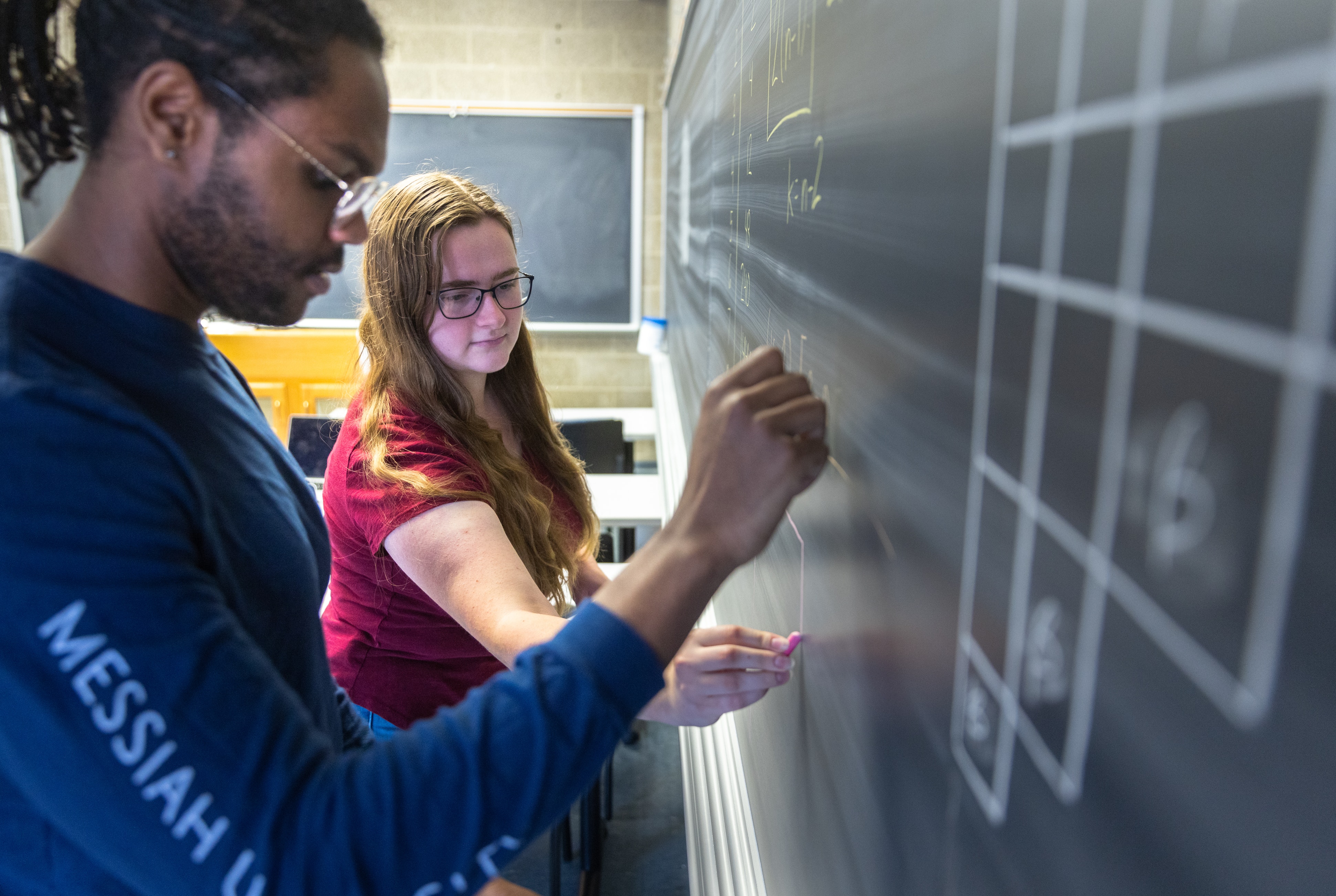 Student at a blackboard