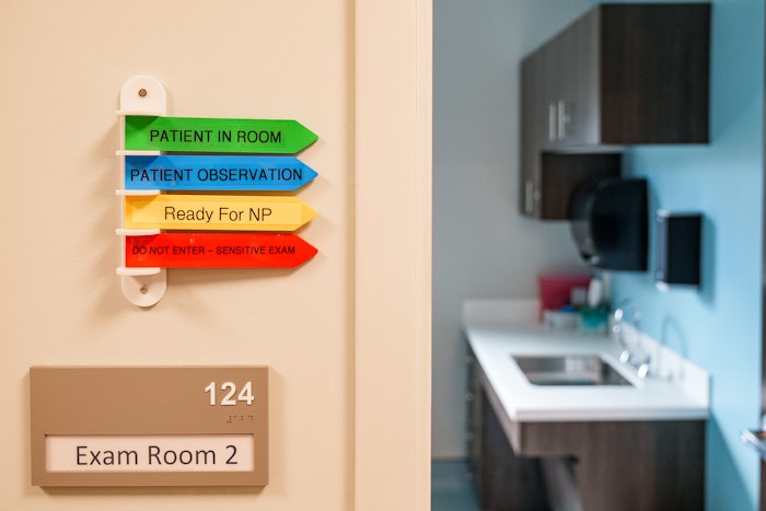 A door label outside a patient room in the Engle center