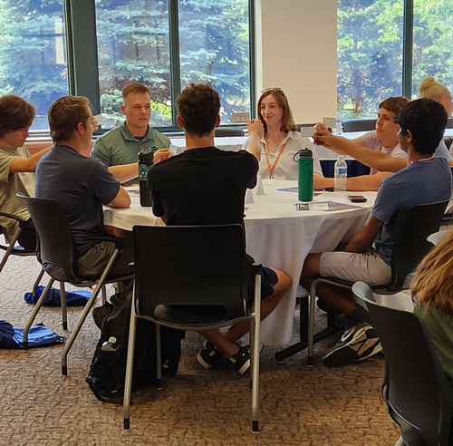 Students talking with local healthcare professionals