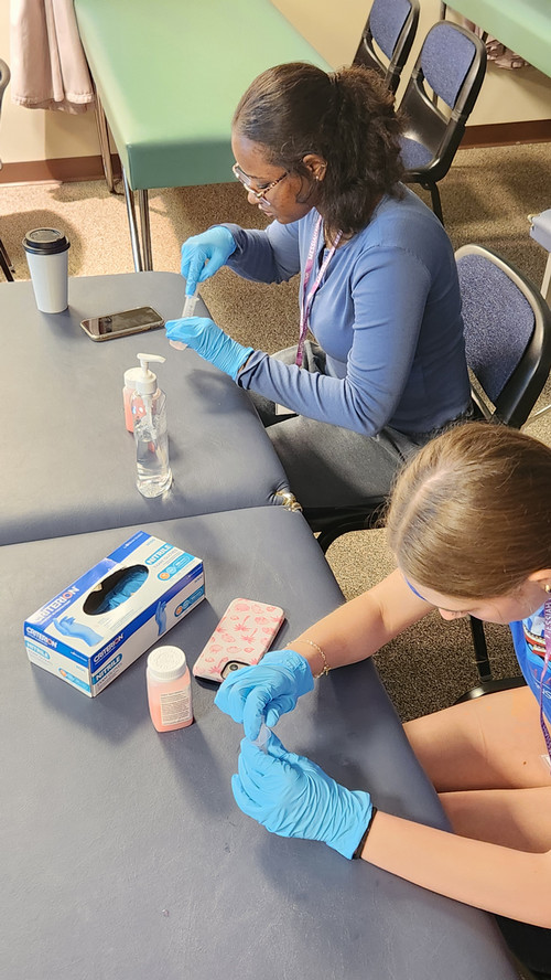 Students measuring medication