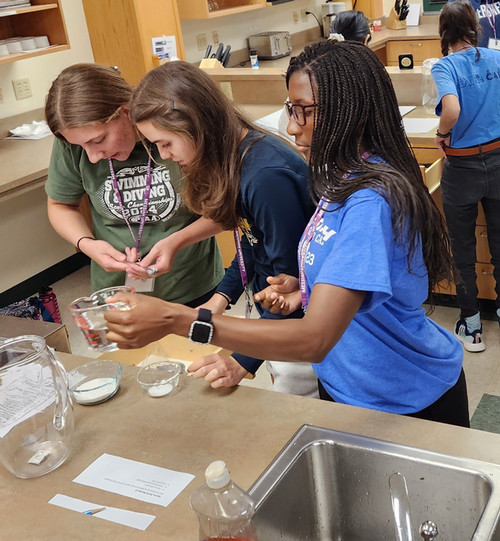 Student cooking in nutrition lab