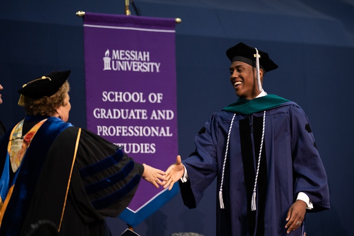 A student at Graduate commencement
