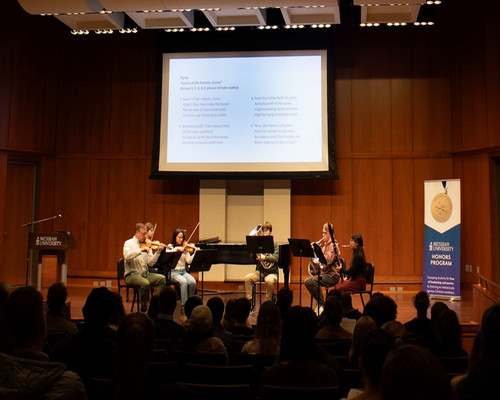 Professor LaGrand and students playing instruments