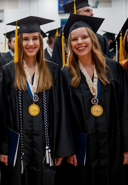 Students standing at graduation