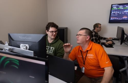 people sitting at computer