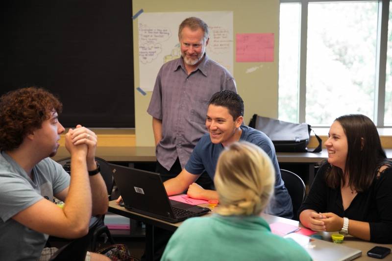 Students having a group discussion in class.