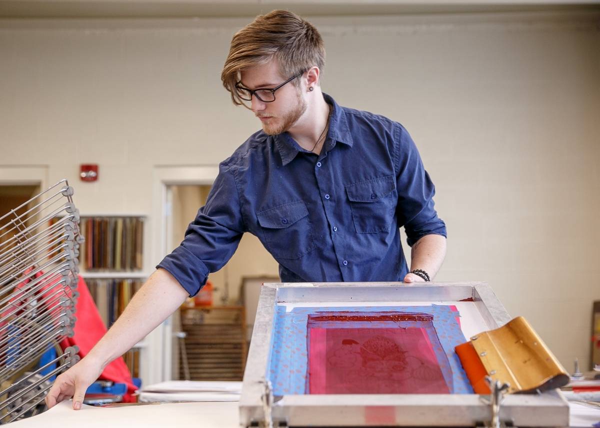 Student working in printmaking studio