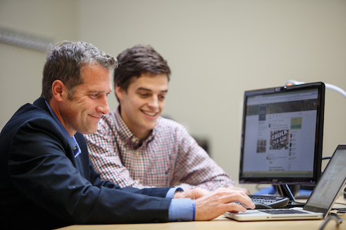 A mentor instructing his student.