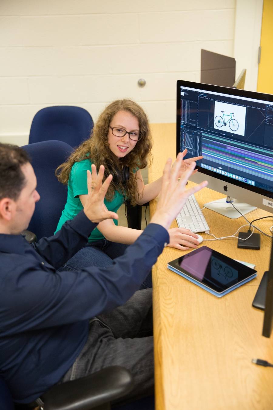 Student editing a film using Final Cut Pro