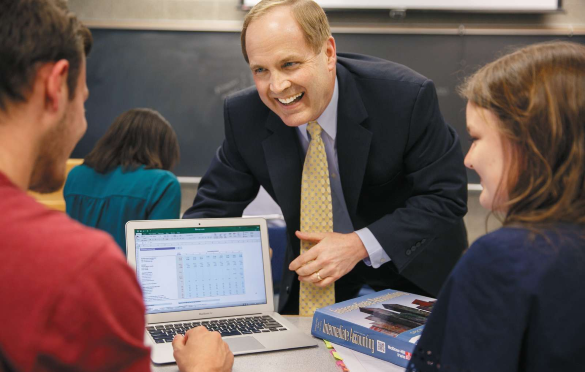 Photo of faculty member instructing students