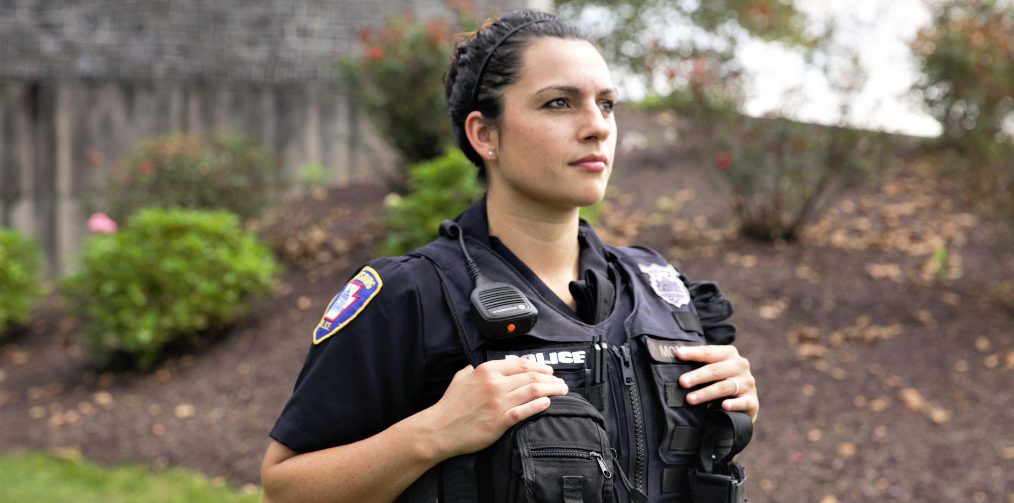 Alumna Adrienne Monroy as a police