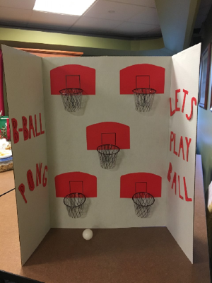 A game on poster board with basketball nets.