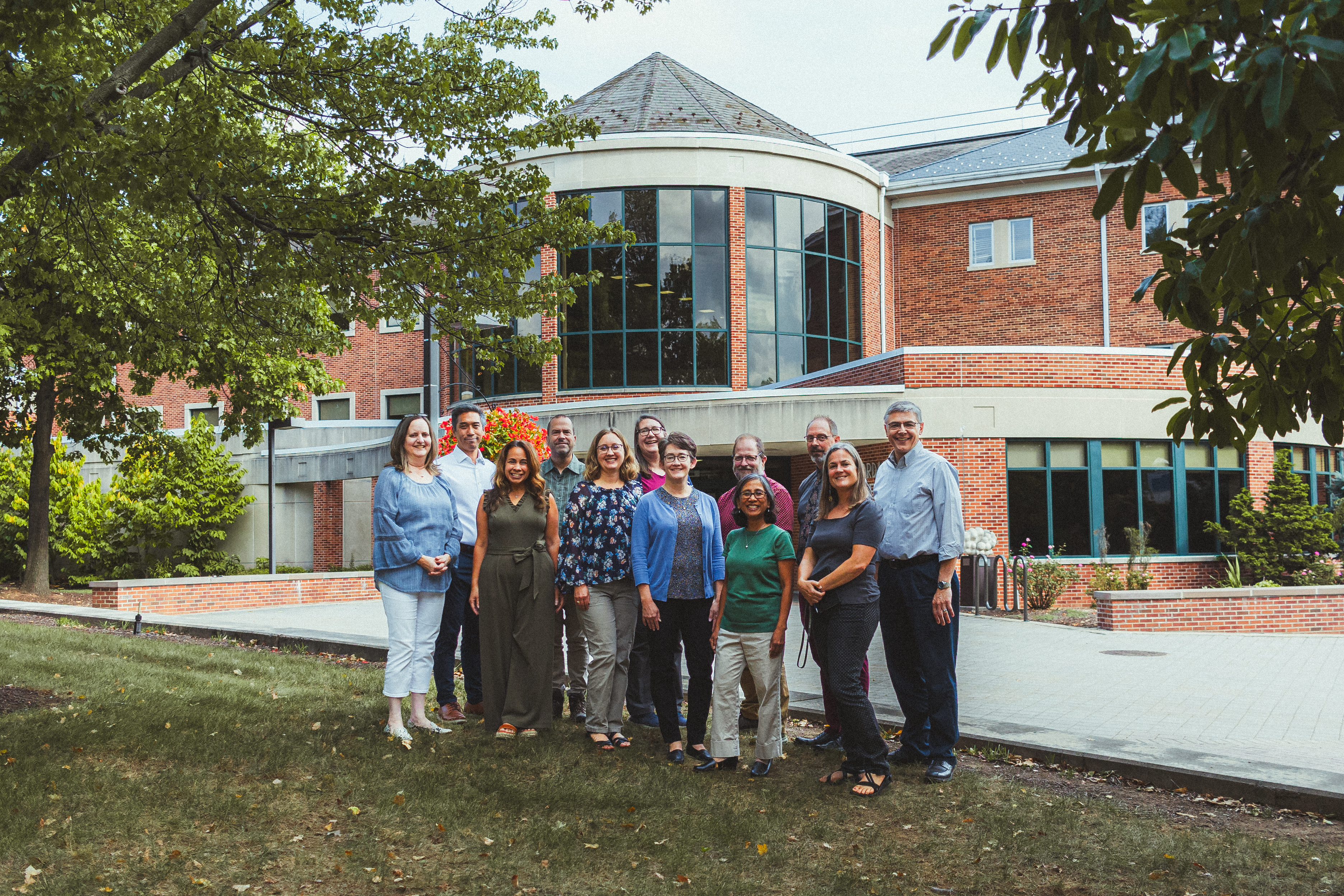 The faculty from the deparment of biological science standing outside of the Kline Jordan Science Center.